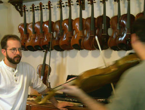 Glen helps a custsomer select the proper bow